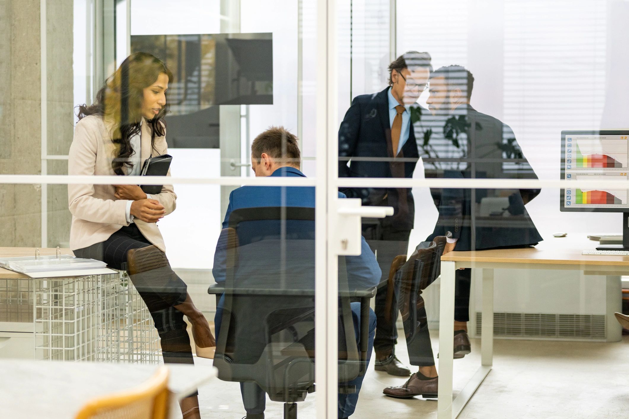 Business people discussing documents in an office meeting
