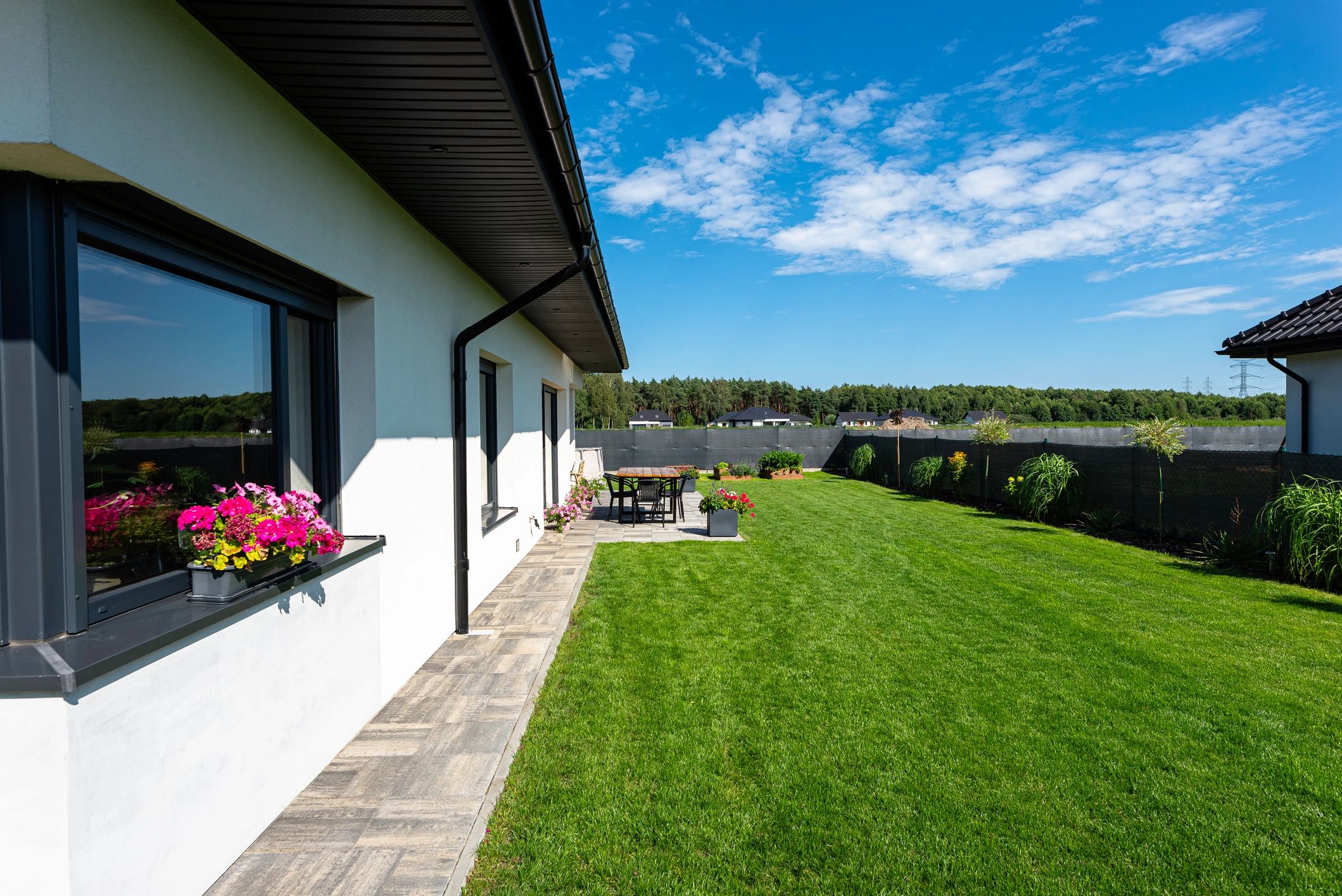 Modern house exterior with green lawn