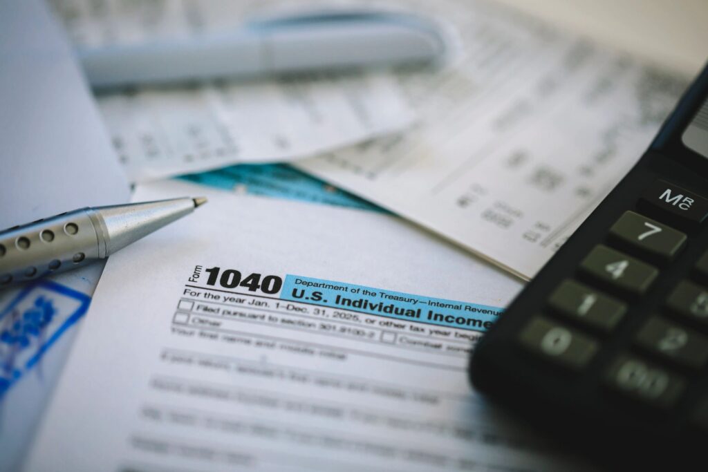 Tax form with receipts and a calculator
